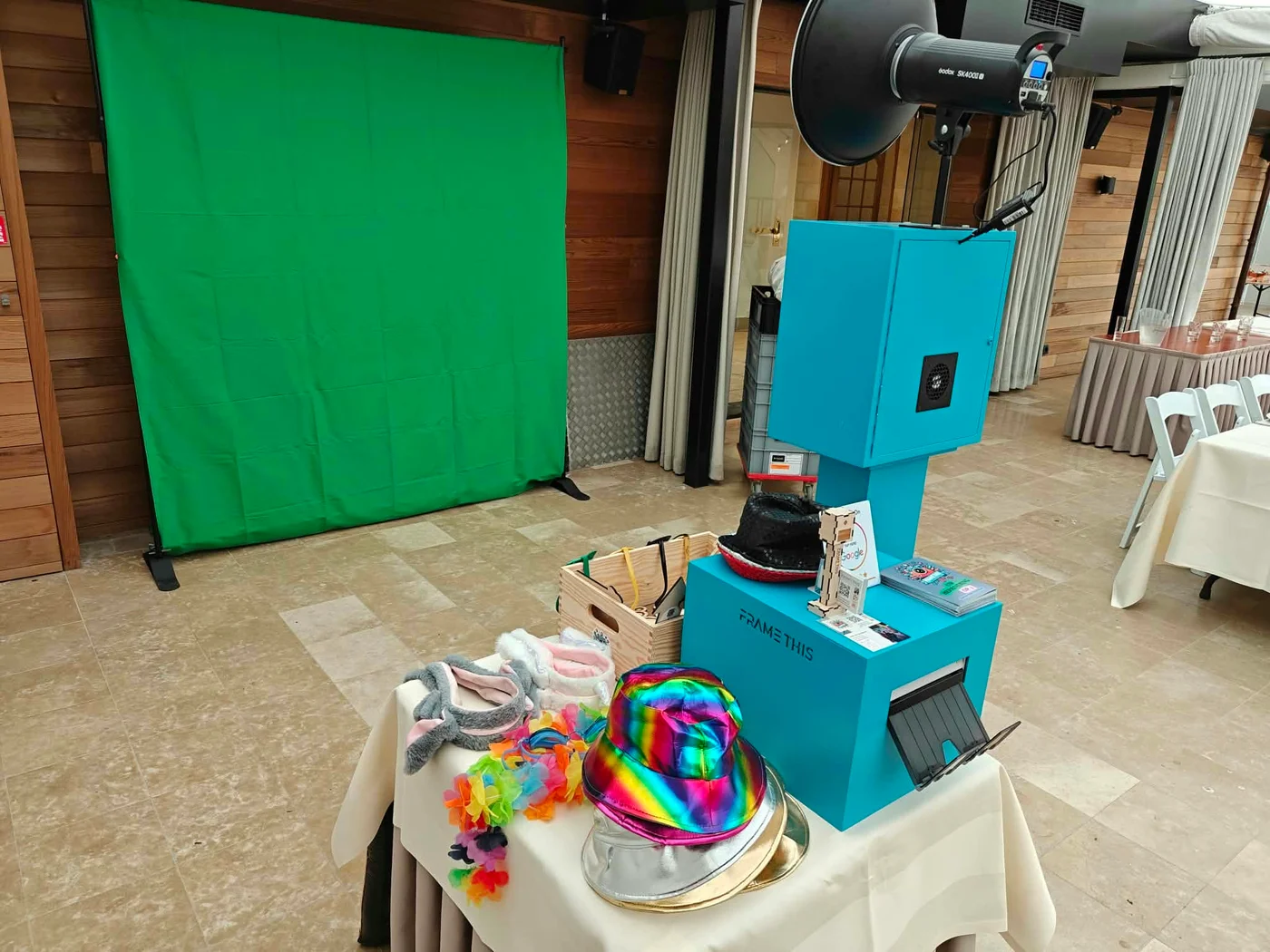 Blue photobooth setup with a green backdrop